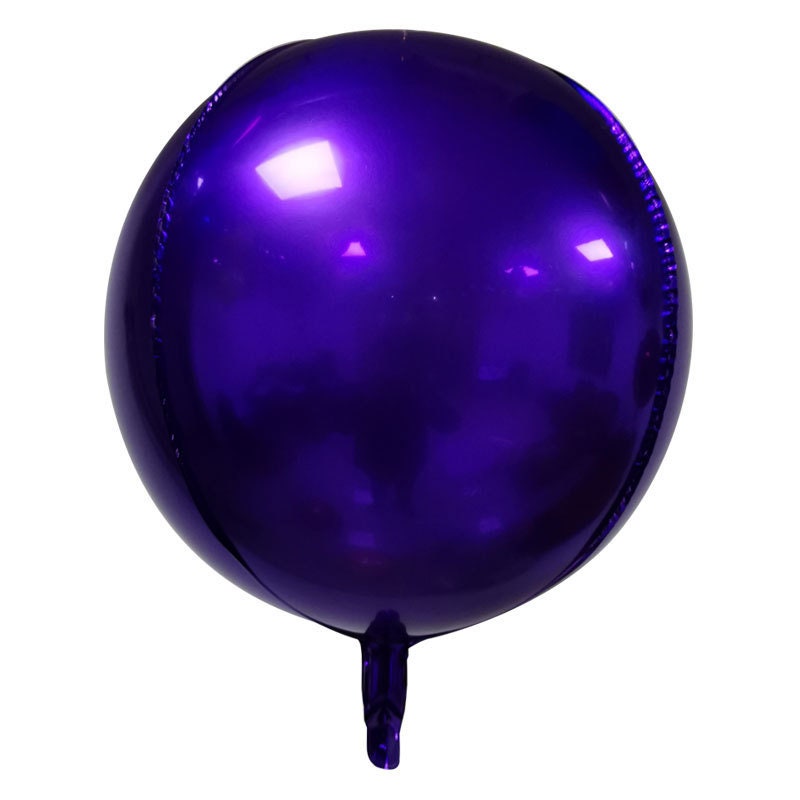 A collection of purple, rose gold, and blue round mylar foil balloons, ready for a festival or wedding.