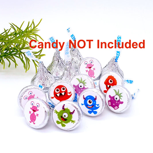 Close-up of small round monster stickers on a sheet for baby shower candy favor treats.