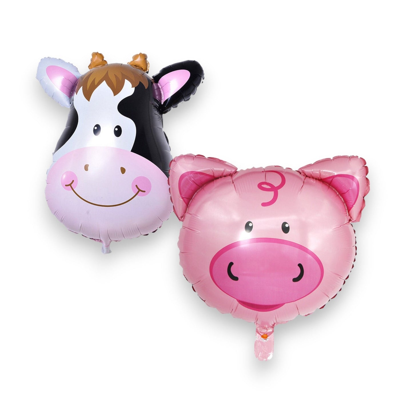 Arrangement of farm birthday party decorations including cow and pig balloons, with confetti.