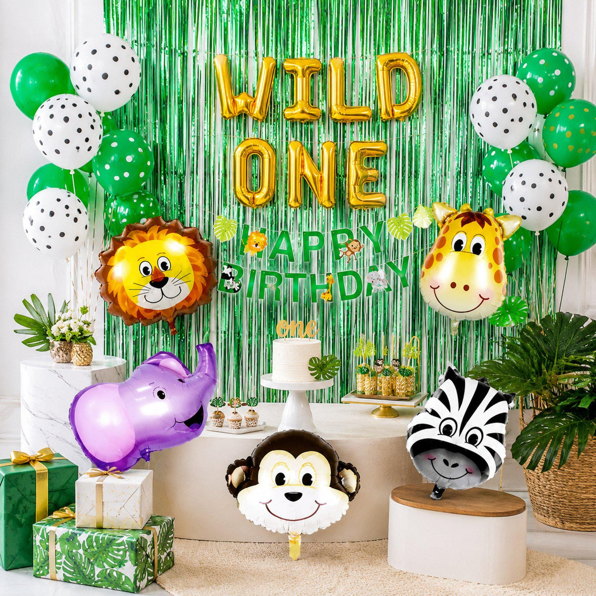Close-up of zebra and giraffe animal head balloons from the wild one safari party decoration kit.