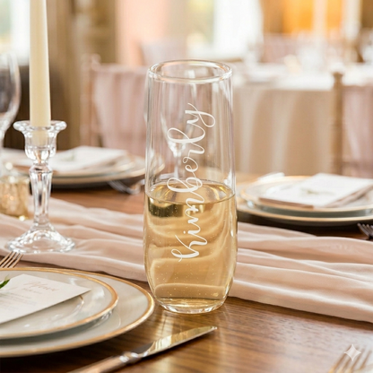 Single personalized champagne glass with custom laser engraving, elegant for wedding or celebration.