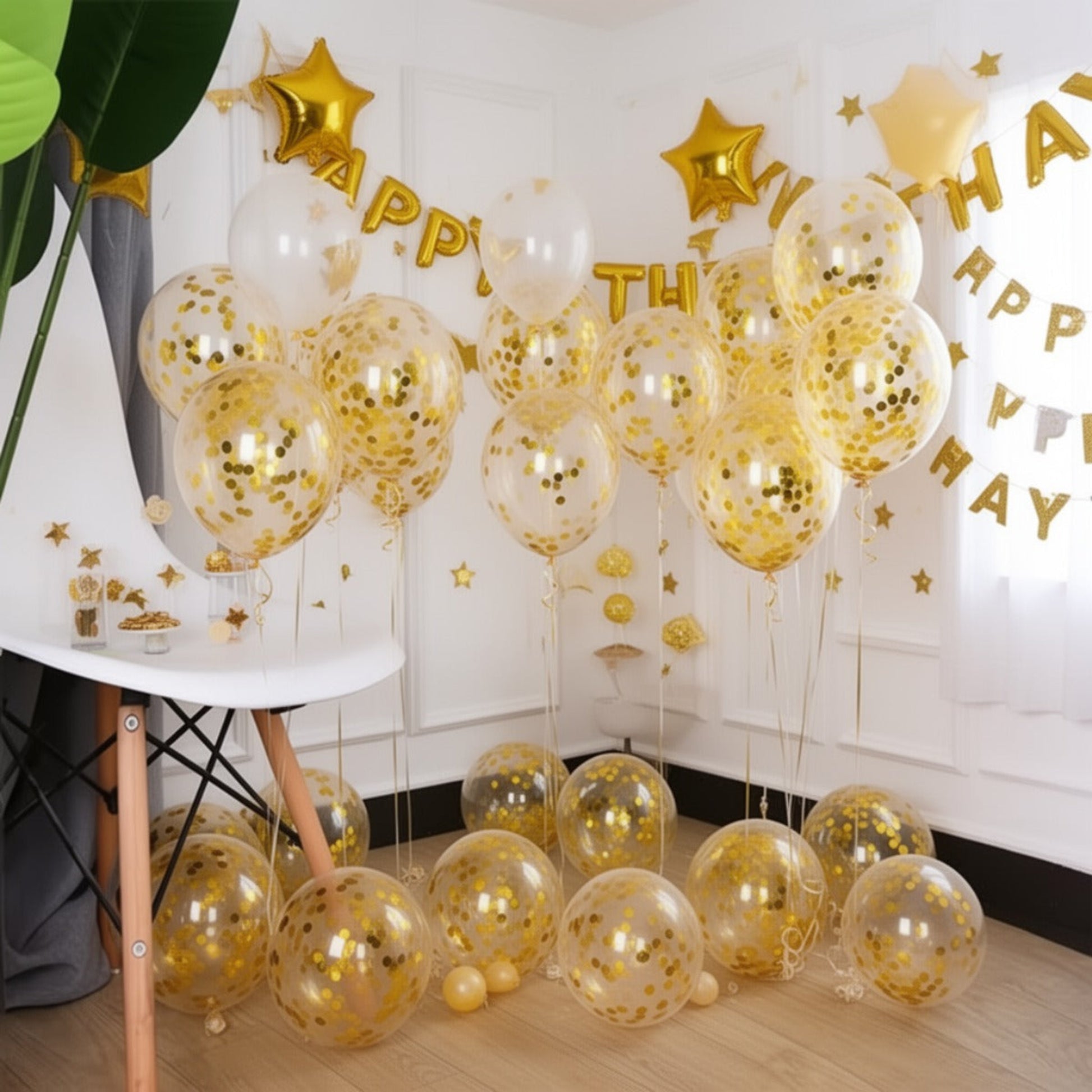 clear balloons with gold confetti inside