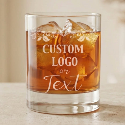 Personalized whiskey glass with an engraved business logo, presented as a corporate client gift.