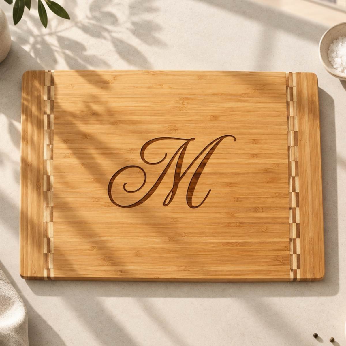 Close-up of an engraved bamboo cutting board showcasing personalized text and a custom design.