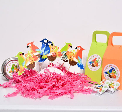 Colorful parrot cardstock picks displayed with green and orange favor boxes, round tins, and pink paper filler.