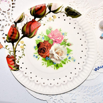 Close-up of a single rose garden paper dessert plate, highlighting the intricate vintage flower illustration.