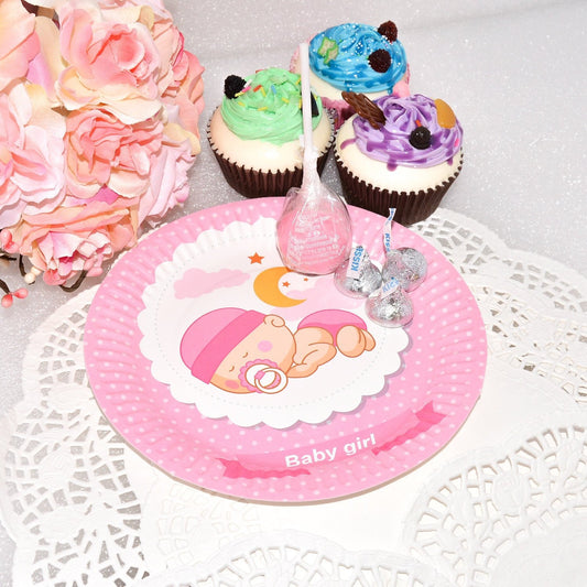 Close-up of a single 7-inch pink paper plate featuring a cute sleeping baby girl surrounded by soft floral details.