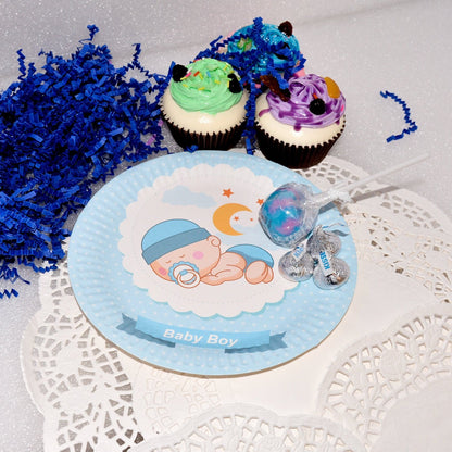Detail shot of the edge of a blue sleeping baby boy dessert plate, showing the quality paper material.