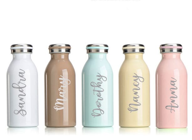 Handheld view of a personalized 12oz double-walled pastel tumbler with custom name.