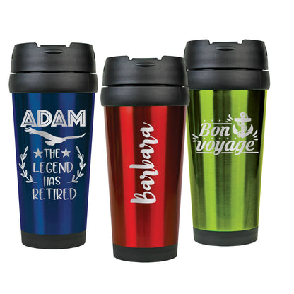 A custom travel mug with engraving sitting on a wooden table, highlighted by natural morning light.