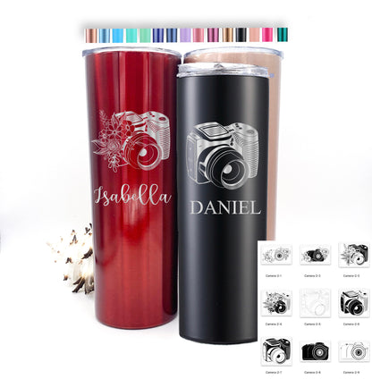 Collection of various colored custom photographer travel mugs, each with a unique laser-engraved design.
