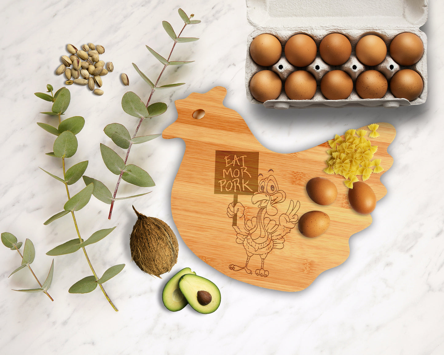 Full view of a natural bamboo chicken cutting board with a detailed laser-engraved hen design.