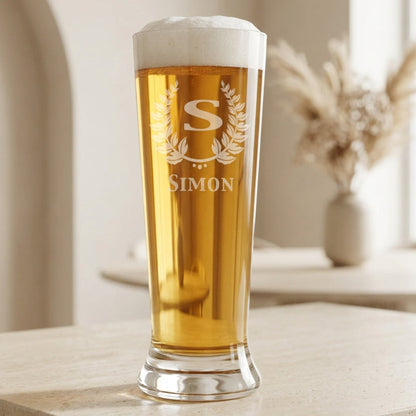 Personalized 16.25 oz pilsner beer glass laser engraved with monogram S in a laurel wreath and the name Simon