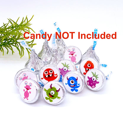 Close-up of small round monster stickers on a sheet for baby shower candy favor treats.