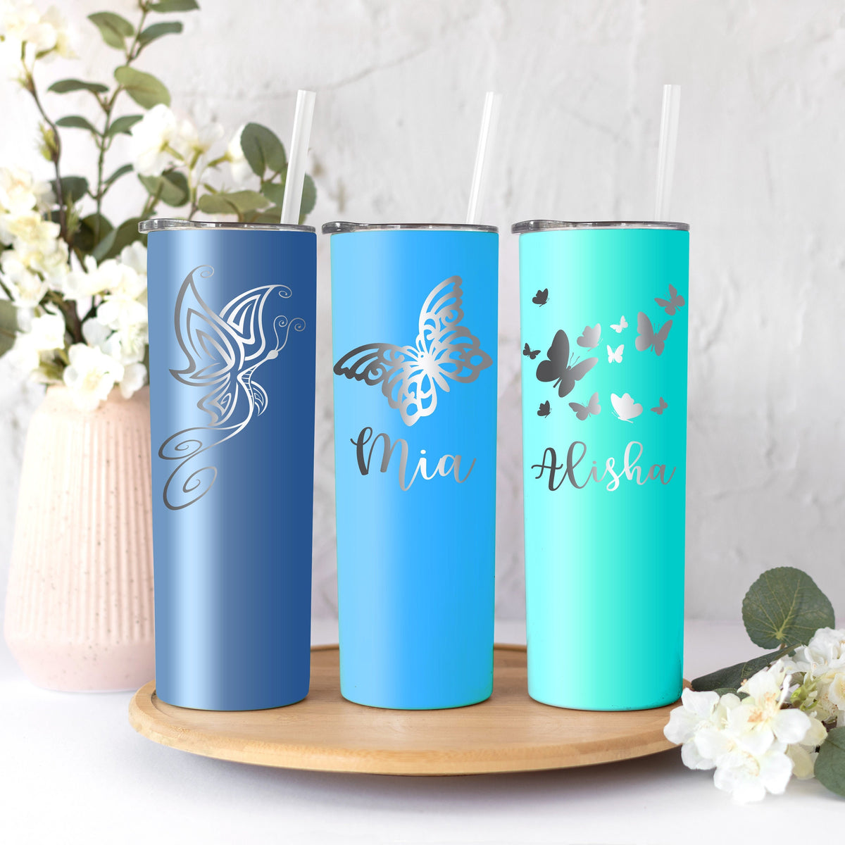 Top-down view of a personalized butterfly tumbler with its clear, snap-on lid.