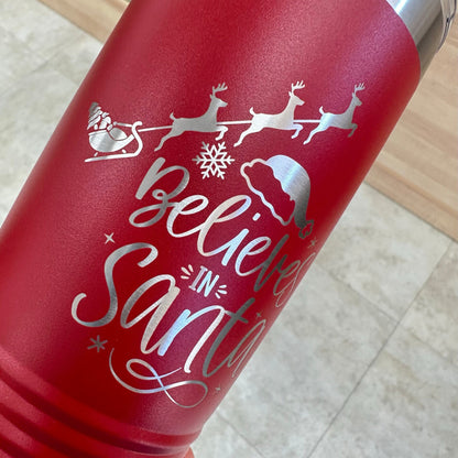 Group of three red 'Believes in Santa' tumblers, showcasing the festive personalized design and durable stainless steel.
