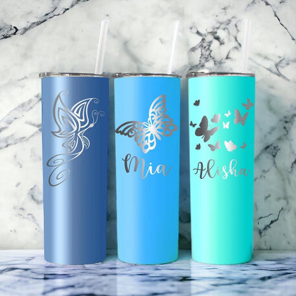 Custom laser engraved tumbler, 20 oz, with butterfly art, in a lifestyle setting.