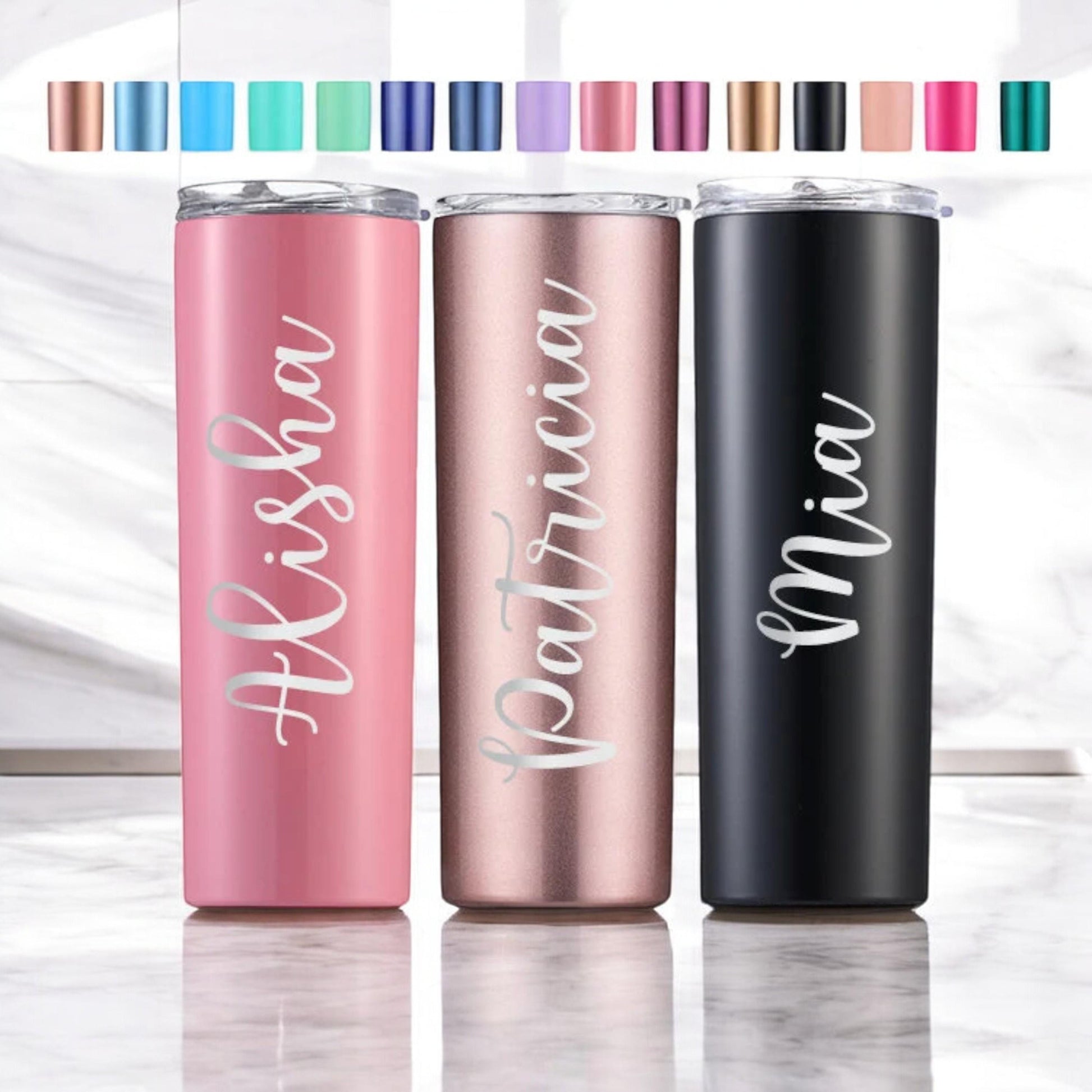 A custom laser engraved 20 oz stainless steel tumbler with a personalized name on its side, ready for gifting.