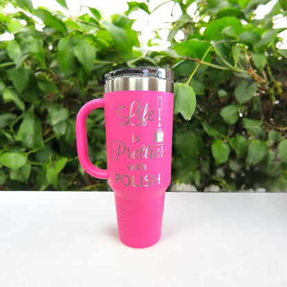 A nail tech holding a personalized nail salon tumbler with handle, showing its size and ergonomic design in use.