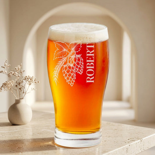 Personalized 16 oz pint beer glass laser engraved with hop cones, hop leaves and barley ear and the custom name Robert