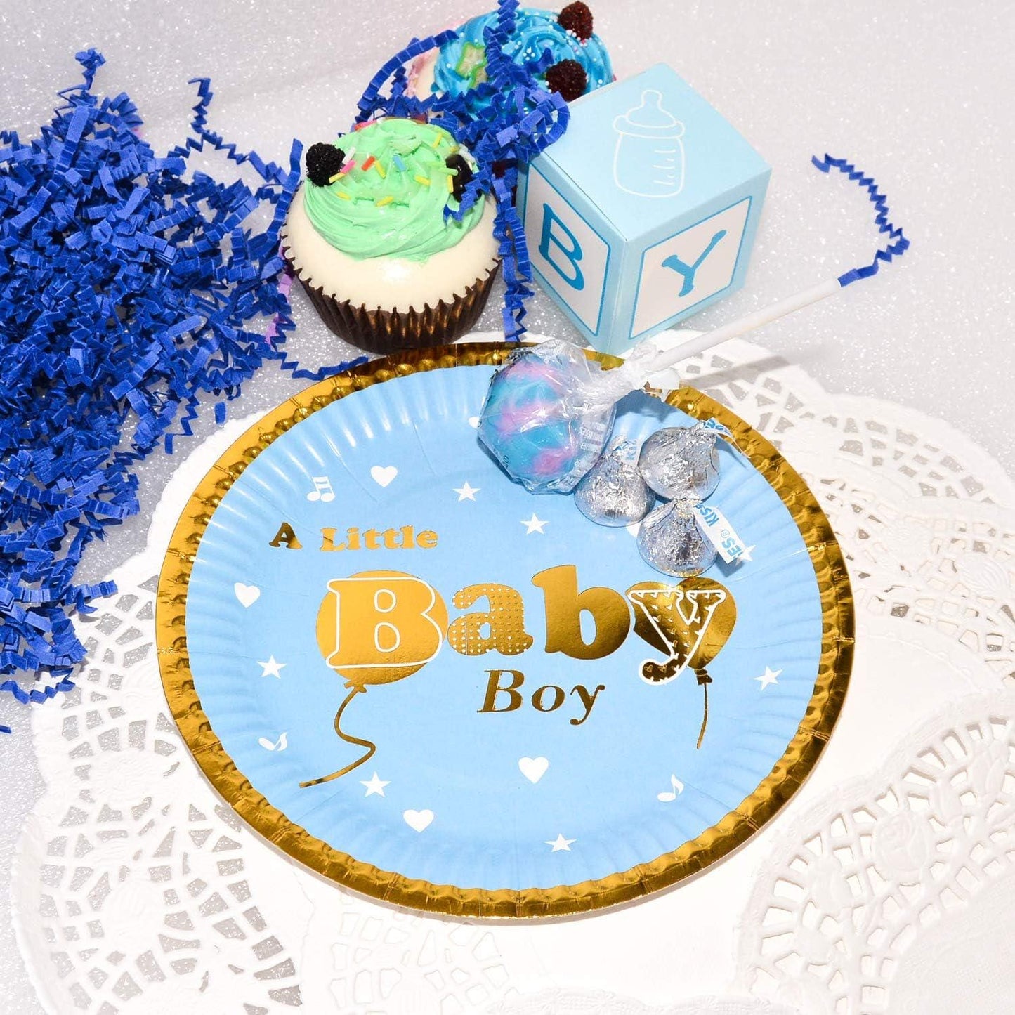 Detail shot of a pink gold foil baby shower plate with shimmering accents, perfect for desserts.