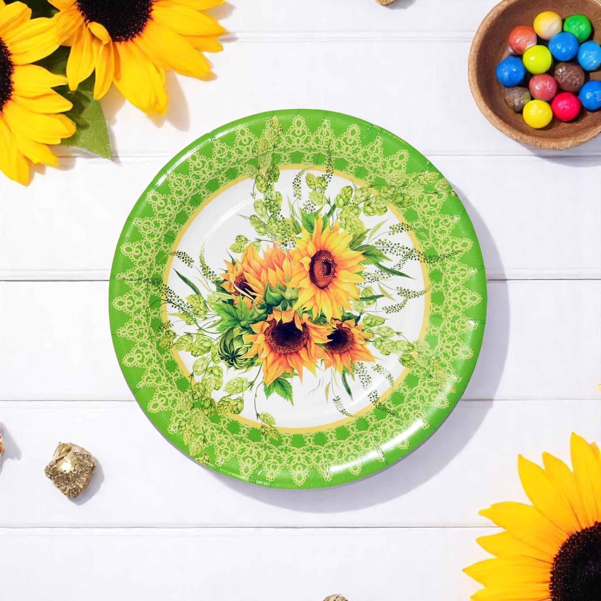 Overhead view of multiple sunflower-themed dessert plates, perfect for a cheerful party table setting.