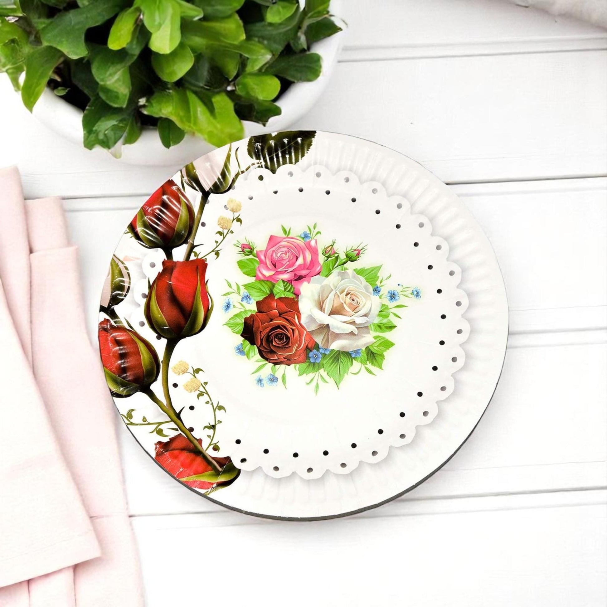 Set of rose garden paper dessert plates fanned out to reveal the full vintage floral design and border detail.
