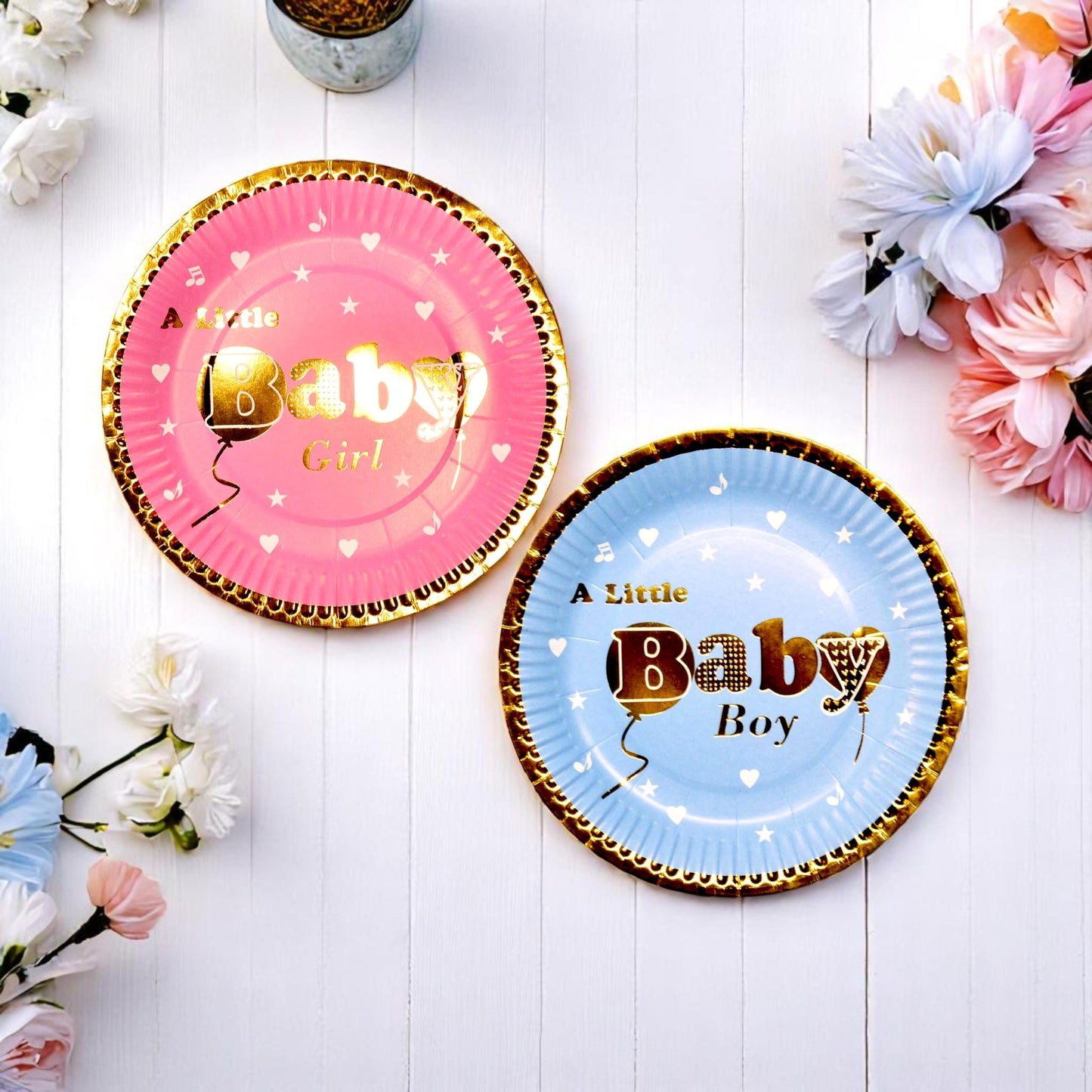 Stack of blue and pink gold foil baby shower plates with elegant designs, ideal for gender reveal parties.