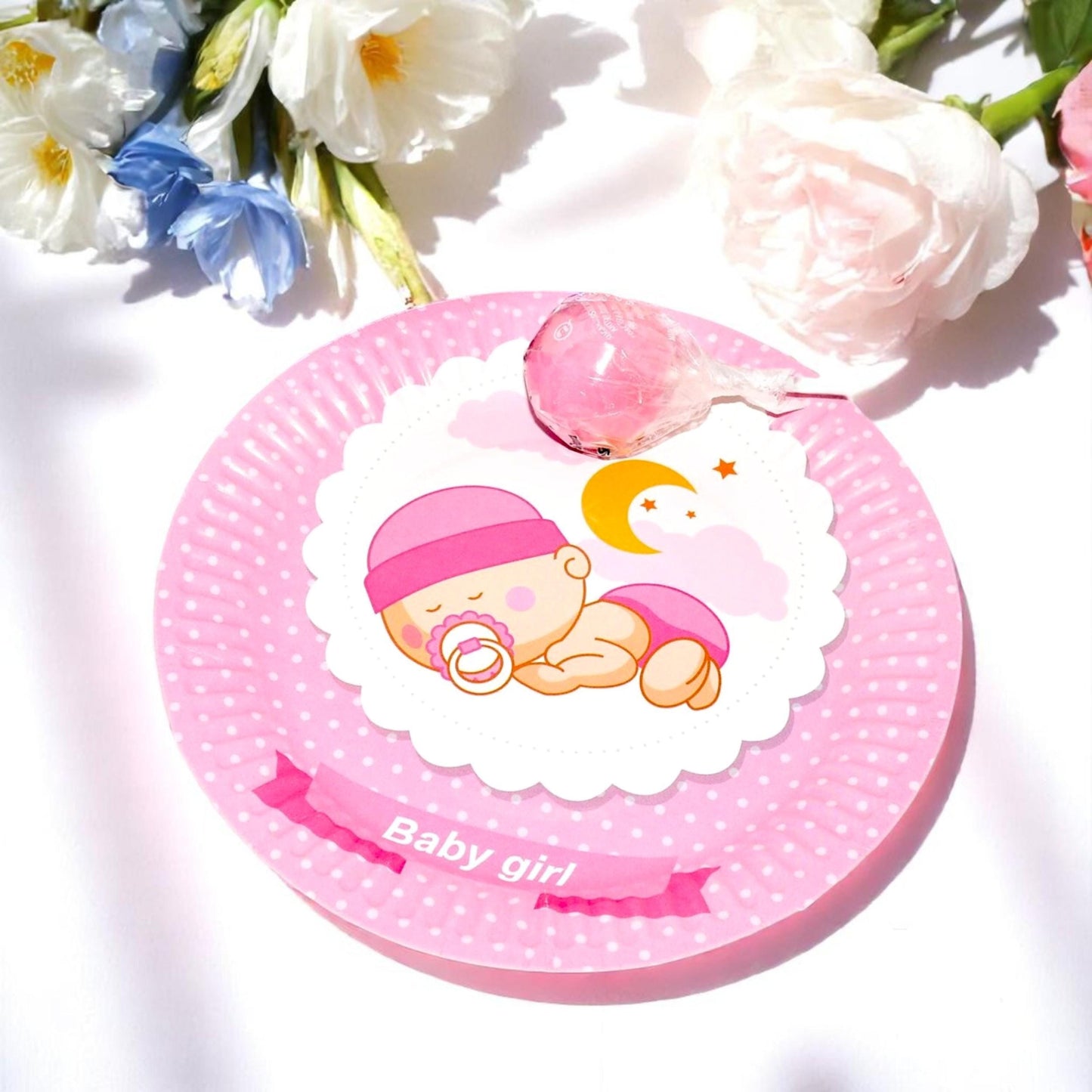 Stack of 40 round pink dessert plates with a sleeping baby girl design and delicate floral accents, for baby showers.