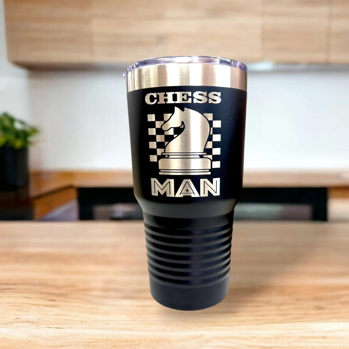 Close-up of the permanent laser engraving on a 30 oz chess tumbler, showcasing the sharp details of the chess design.
