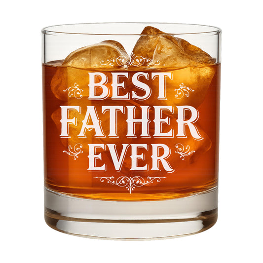 Whiskey glass with "Best Father Ever" engraving, shown with a bottle of bourbon in a home bar setting.