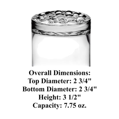 Freemason rocks glass with square and compass, shown next to a bottle of whiskey on a wooden surface.