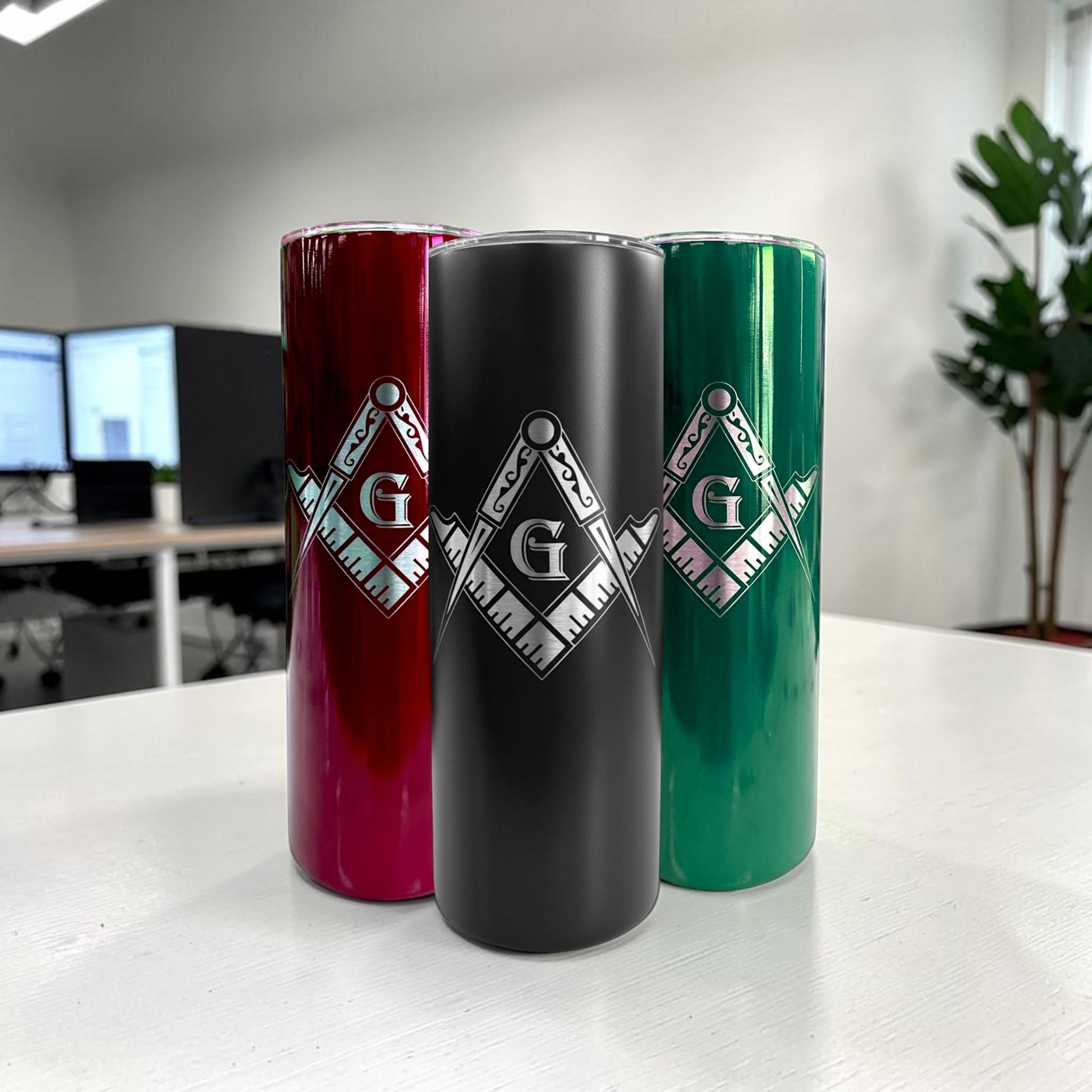 Close-up of a black 20 oz freemason tumbler with a detailed laser engraved masonic symbol.