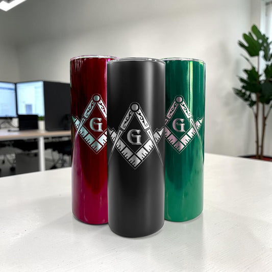 Close-up of a black 20 oz freemason tumbler with a detailed laser engraved masonic symbol.