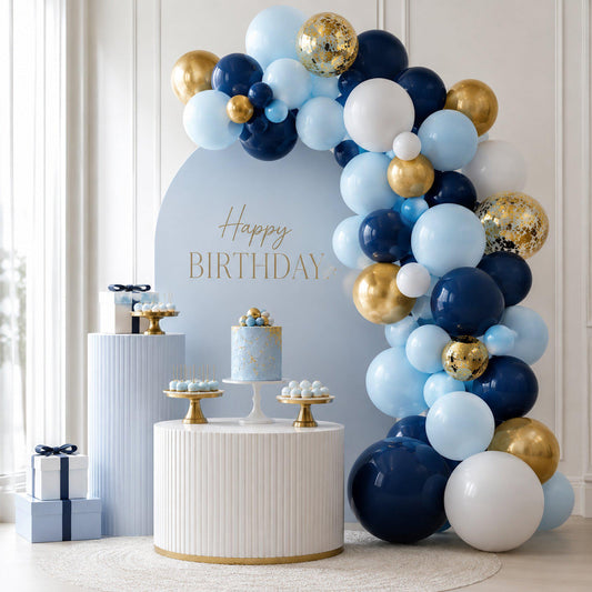 A stunning blue and gold balloon arch featuring matte navy, baby blue, and metallic gold balloons, arranged as a party backdrop.