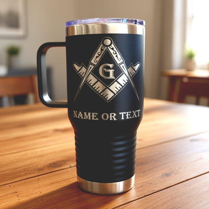 Close-up detail of the precision-engraved compass and square emblem on a stainless steel masonic tumbler.