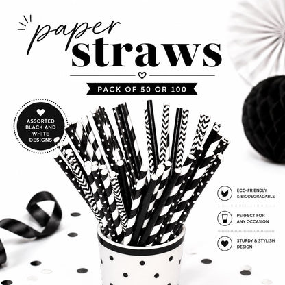 Arrangement of multiple black paper straws in a clear glass, perfect for a party drink display.