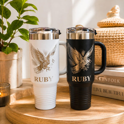 Engraved crow travel tumbler in matte black with a shiny silver bird design.