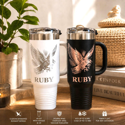 Engraved crow 40 oz travel tumbler with handle in white black with a shiny silver  or rose gold bird design.