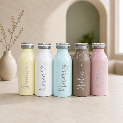 Personalized 12 oz pastel water bottle in a soft blue shade, engraved with a custom name.