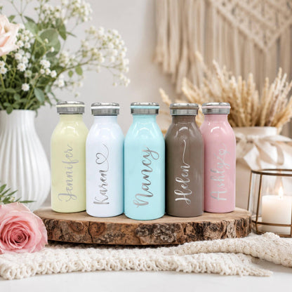 Pastel water bottle in white, featuring a custom name laser-engraved on the side.