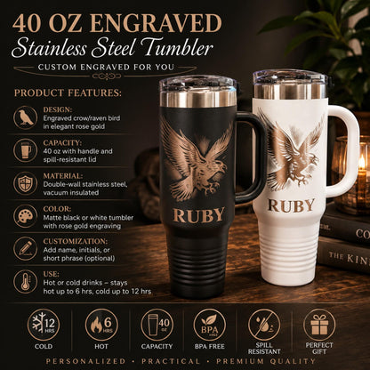 Laser-engraved crow design on a black 40 oz stainless steel tumbler with handle.