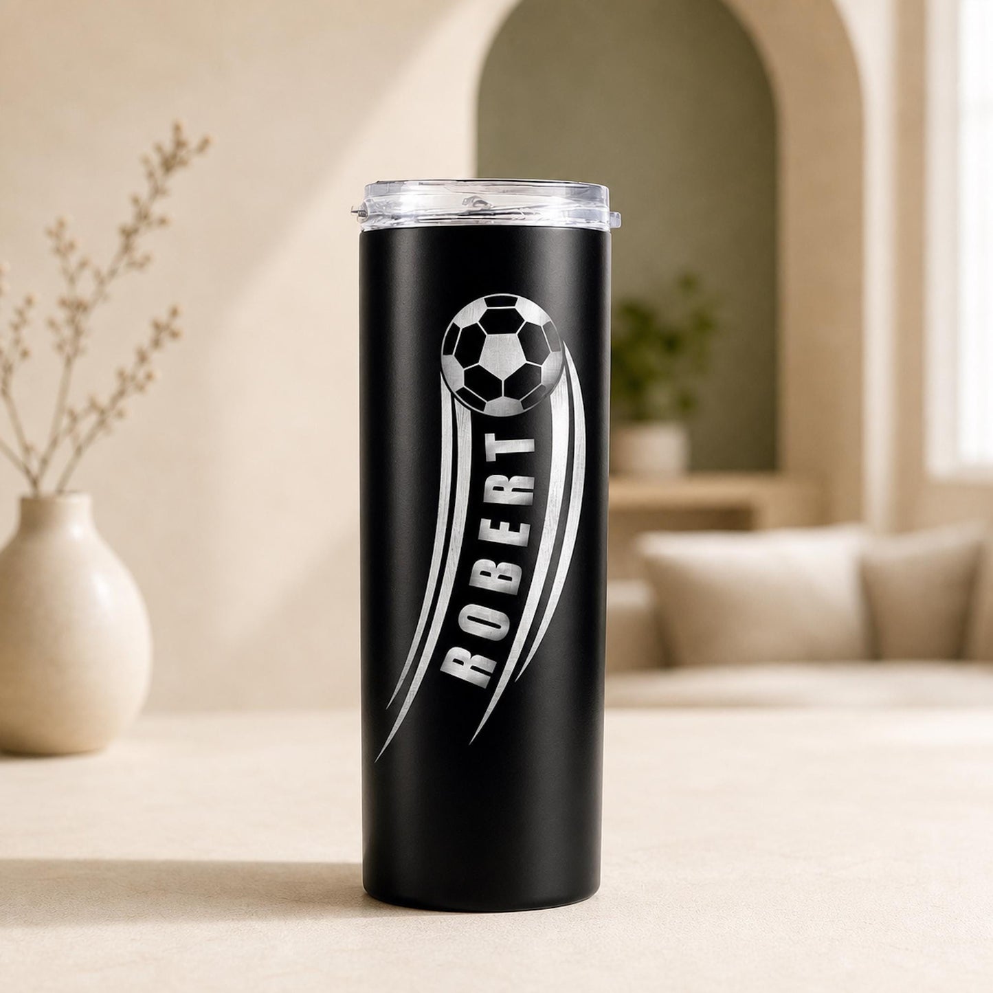 A personalized soccer gift tumbler with a laser-engraved soccer ball design and custom text, in a stainless steel finish.