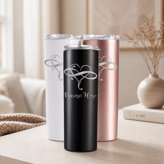 White, black, and rose gold wedding tumblers engraved with infinity hearts and custom names.