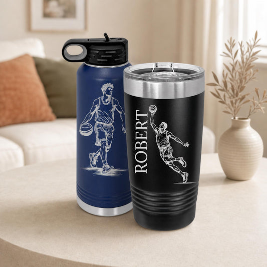 Navy water bottle and black handled tumbler engraved with basketball players and a custom name.