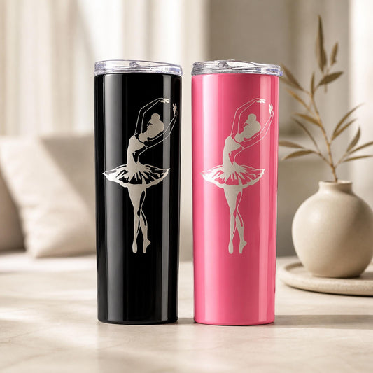 Black and pink personalized ballerina tumbler pair with silver dancer silhouettes in a softly lit room.