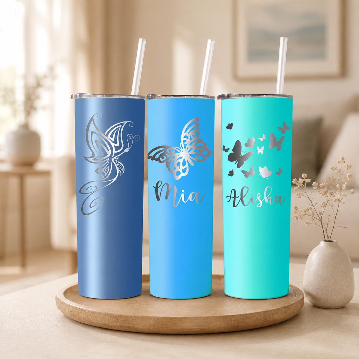 Custom laser engraved tumbler, 20 oz, with a delicate butterfly design for personalized gifting.