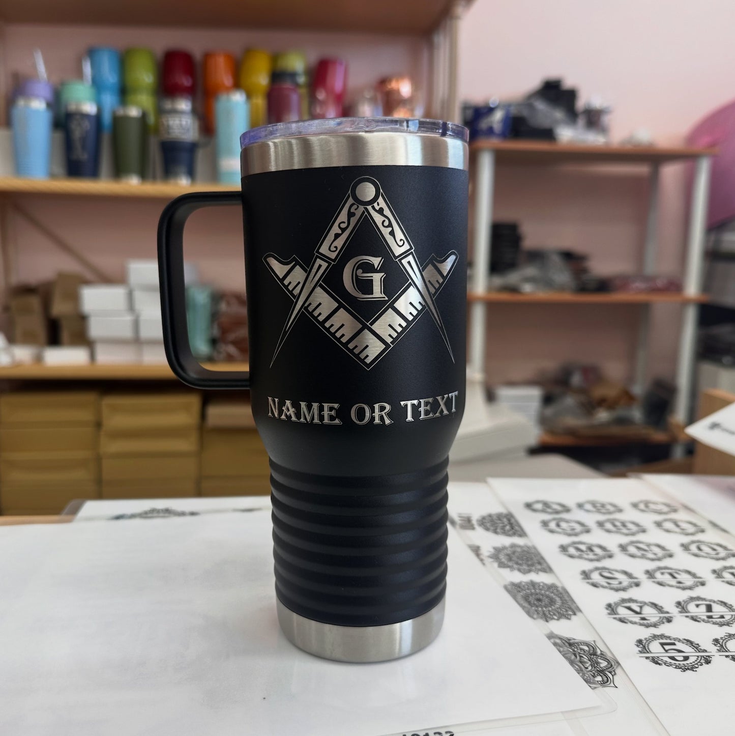 Masonic emblem tumbler held in hand, highlighting its size and comfortable grip for daily use.