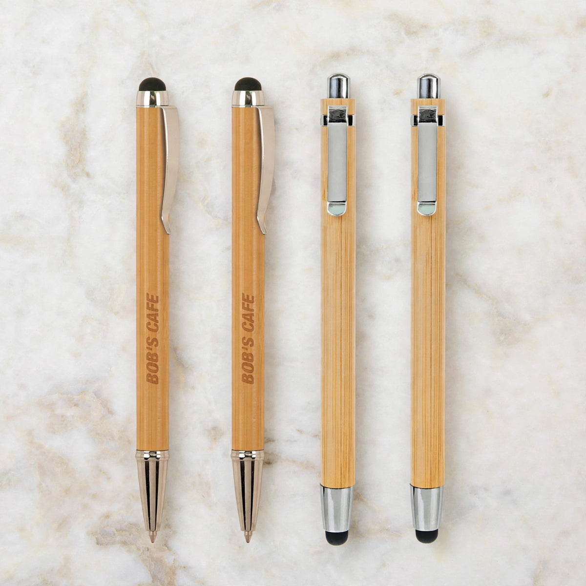 Four engraved bamboo pens with stylus, twist and click styles, laser engraved with a business name