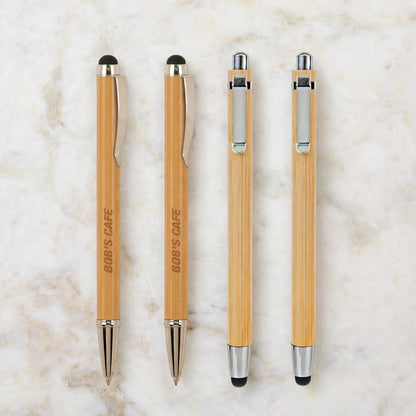 Four engraved bamboo pens with stylus, twist and click styles, laser engraved with a business name